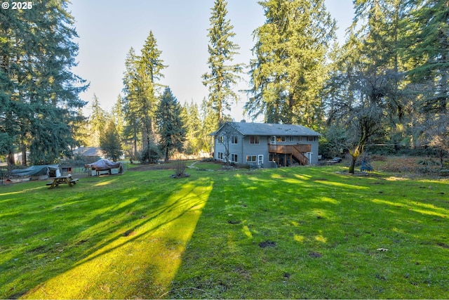 24492 SE Three Cedars St, Damascus, OR 97089 - view of green lawn featuring stairs and a deck