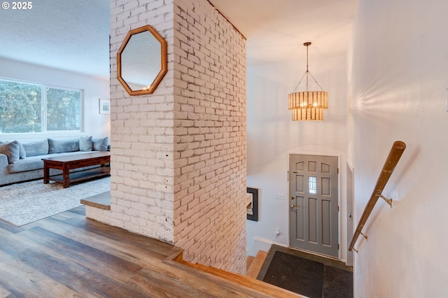 24492 SE Three Cedars St, Damascus, OR 97089 - entrance foyer featuring wood finished floors and a chandelier