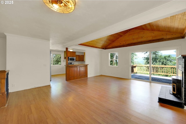 8157 S A St, Springfield, OR 97478 - unfurnished living room featuring a wood stove, light wood-style floors, and wooden ceiling