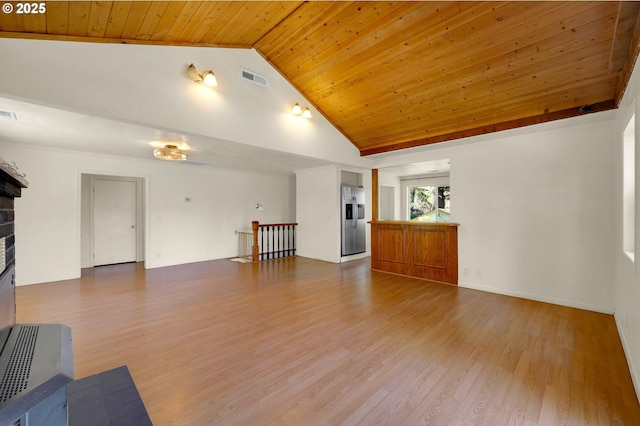 8157 S A St, Springfield, OR 97478 - unfurnished living room featuring wooden ceiling, wood finished floors, a brick fireplace, and high vaulted ceiling