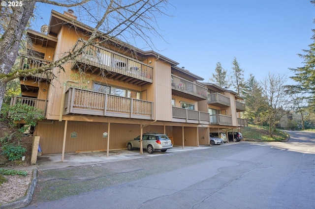 view of property featuring covered parking