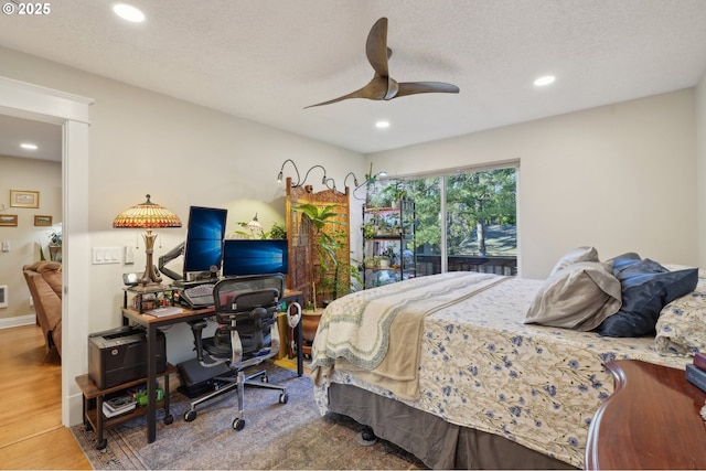 7548 SW Barnes Rd Unit G, Portland, OR 97225 - bedroom featuring wood finished floors, recessed lighting, a desk, and a ceiling fan