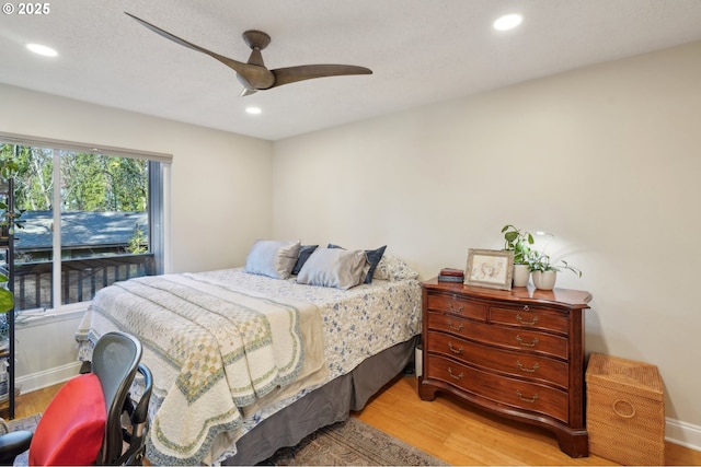 7548 SW Barnes Rd Unit G, Portland, OR 97225 - bedroom featuring wood finished floors, recessed lighting, a ceiling fan, and baseboards