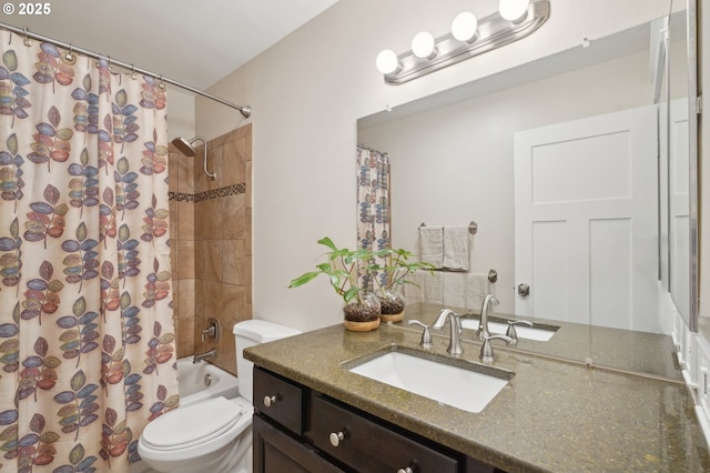 kitchen with arched walkways, stainless steel dishwasher, wood finished floors, white cabinets, and baseboards