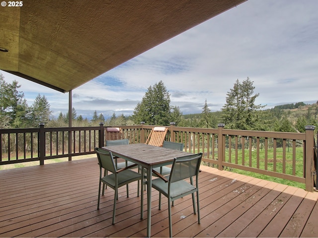 deck featuring outdoor dining area