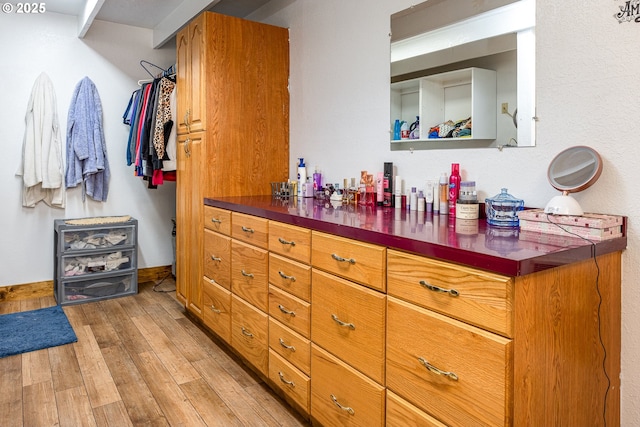 spacious closet featuring light wood-type flooring