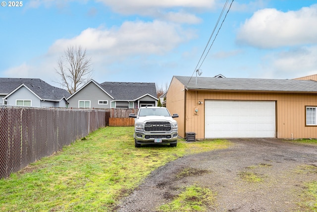 garage with a lawn