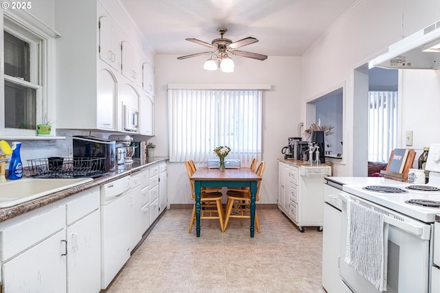 kitchen with ceiling fan, white appliances, sink, and white cabinets