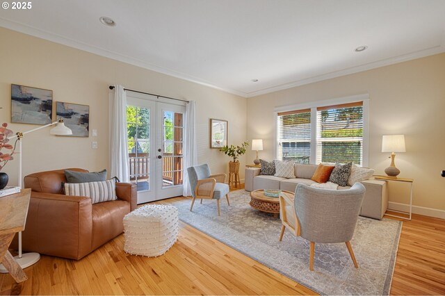 living area featuring french doors, ornamental molding, wood finished floors, baseboards, and recessed lighting