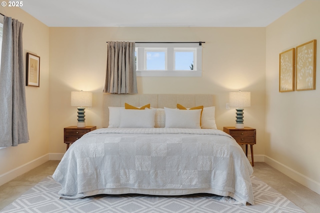 bedroom with carpet flooring and baseboards