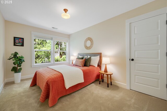 bedroom featuring carpet flooring and baseboards