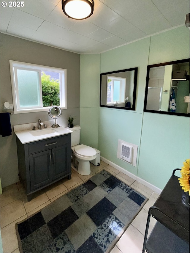 337 Clark St, Eugene, OR 97401 - full bath with vanity, tile patterned flooring, heating unit, and an enclosed shower