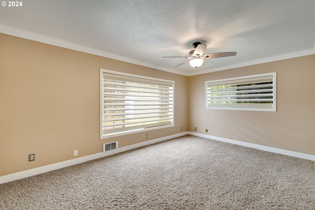 spare room with ceiling fan, a textured ceiling, and ornamental molding