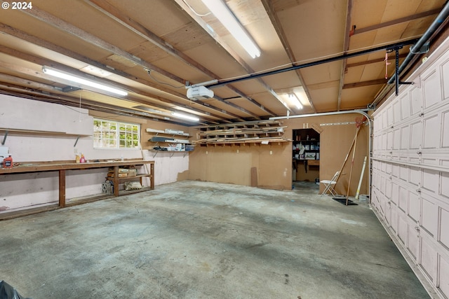 garage featuring a workshop area and a garage door opener