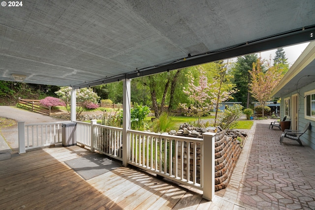 wooden terrace featuring a porch