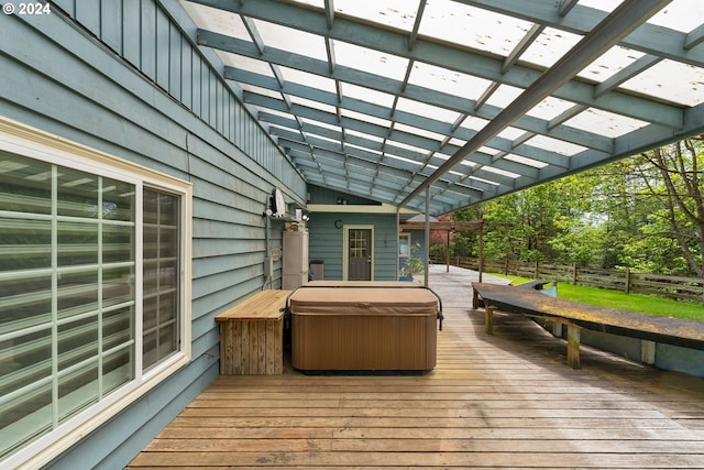 deck featuring a pergola and a hot tub