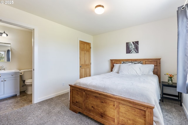 1105 29th St, Hood River, OR 97031 - bedroom with baseboards, light carpet, and ensuite bathroom