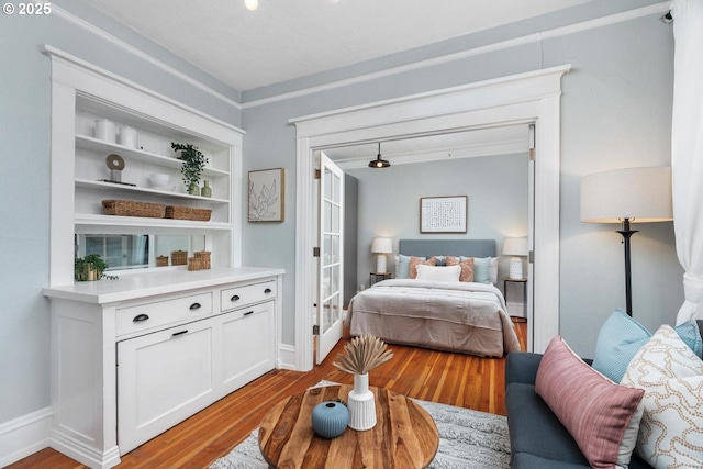 bedroom featuring light hardwood / wood-style floors and access to outside