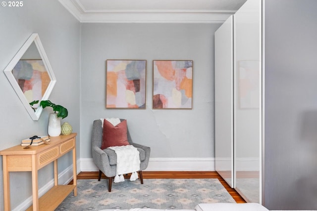 living area featuring ornamental molding and hardwood / wood-style floors