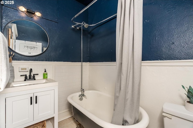 full bathroom with shower / tub combo, toilet, tile patterned flooring, and sink