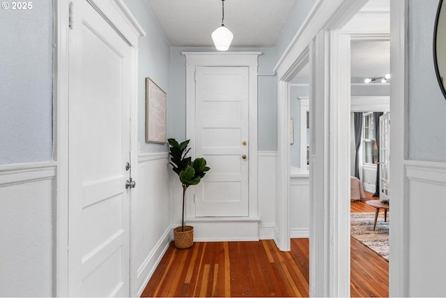 hallway with dark wood-type flooring