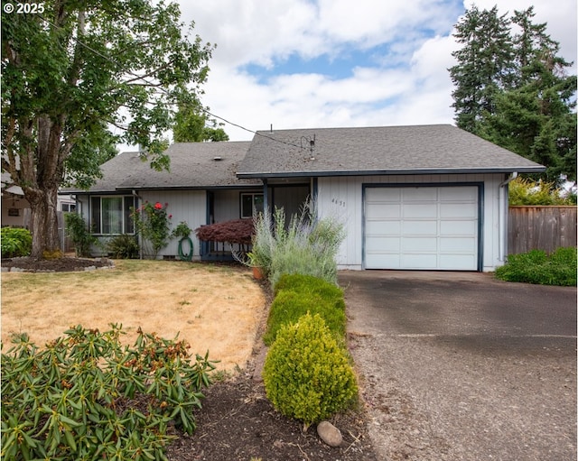4631 Daisy St, Springfield, OR 97478 - ranch-style house featuring asphalt driveway, an attached garage, and a shingled roof