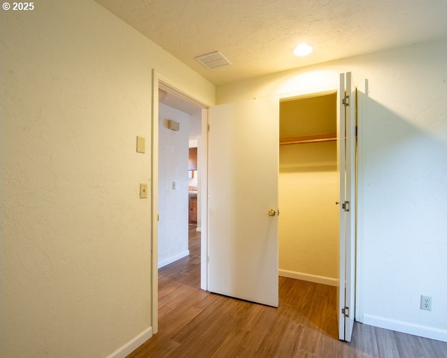 4631 Daisy St, Springfield, OR 97478 - hallway with wood finished floors and a textured ceiling