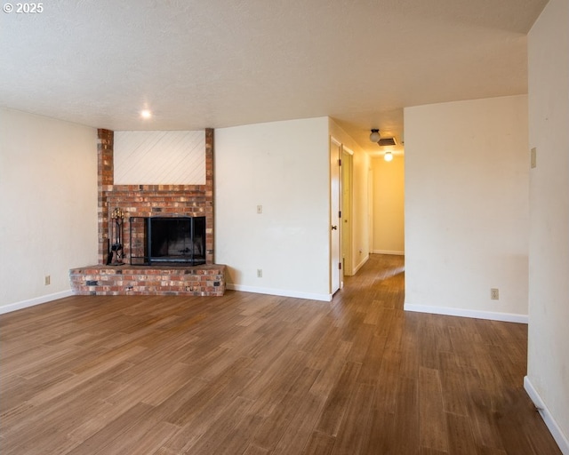 4631 Daisy St, Springfield, OR 97478 - unfurnished living room featuring a brick fireplace and wood finished floors