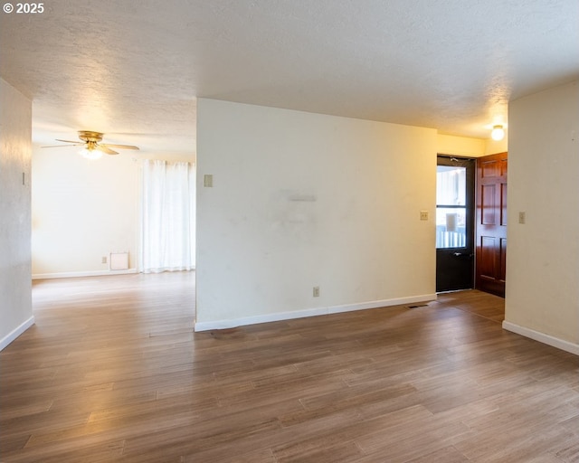 4631 Daisy St, Springfield, OR 97478 - spare room with a ceiling fan, wood finished floors, and a textured ceiling