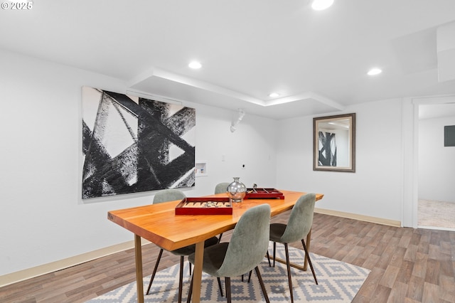 dining room with baseboards, recessed lighting, and wood finished floors