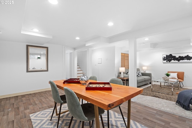 dining area with stairs, recessed lighting, and wood finished floors