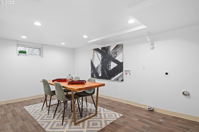 dining space featuring wood finished floors, baseboards, and recessed lighting