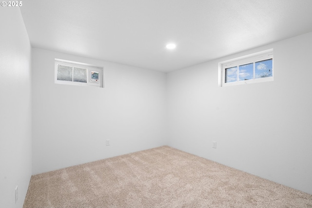 below grade area with a healthy amount of sunlight, recessed lighting, and carpet floors