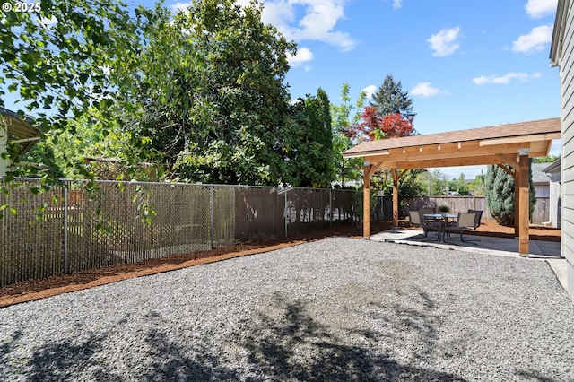 view of yard with a patio area and a fenced backyard