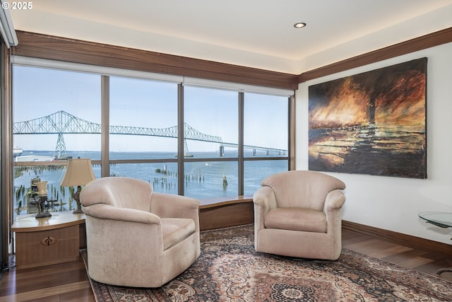1 3rd St Unit 501, Astoria, OR 97103 - sitting room featuring wood finished floors, baseboards, and a water view