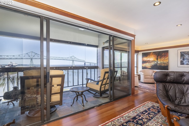 1 3rd St Unit 501, Astoria, OR 97103 - interior space featuring wood finished floors, a water view, and recessed lighting