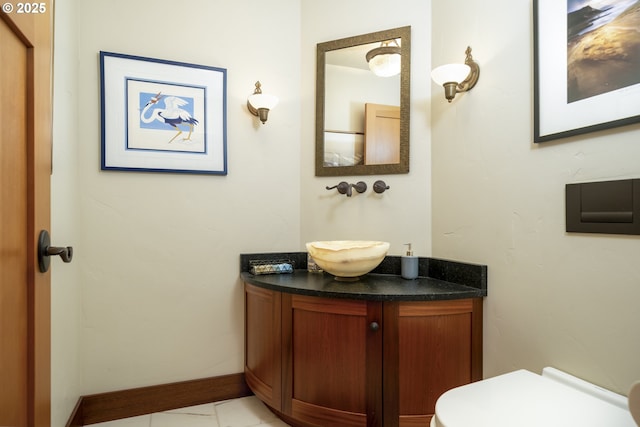 1 3rd St Unit 501, Astoria, OR 97103 - half bathroom featuring vanity, toilet, and tile patterned flooring