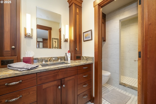 1 3rd St Unit 501, Astoria, OR 97103 - full bathroom featuring vanity, a walk in shower, toilet, and tile walls