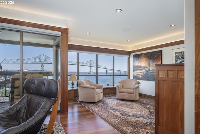 1 3rd St Unit 501, Astoria, OR 97103 - living room with wood finished floors, a water view, and recessed lighting