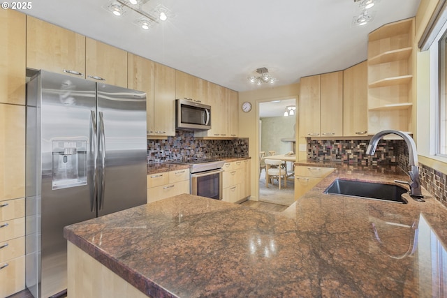 2691 Country Ln, Eugene, OR 97401 - kitchen featuring appliances with stainless steel finishes, light brown cabinetry, open shelves, and decorative backsplash