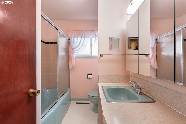 1550 Ash St, Baker City, OR 97814 - bathroom featuring vanity, toilet, and shower / bath combination with glass door