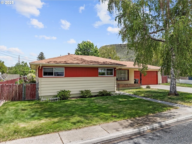 1550 Ash St, Baker City, OR 97814 - ranch-style home featuring a garage, concrete driveway, and a shingled roof