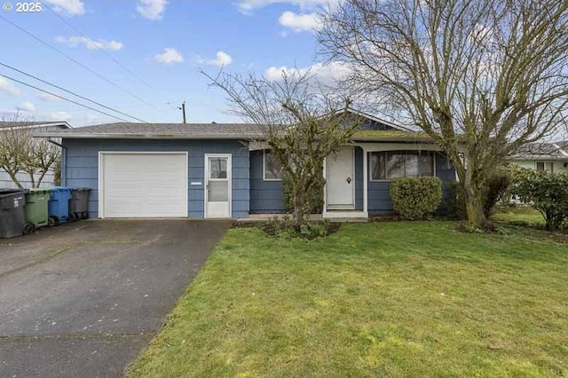 single story home with driveway, a front lawn, and an attached garage