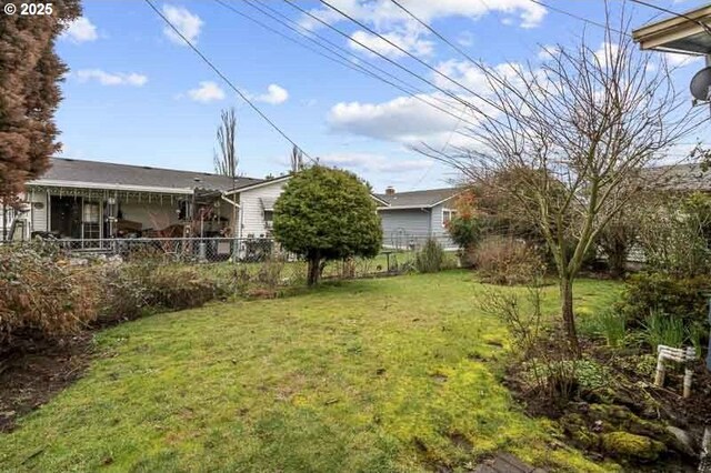 view of yard featuring fence