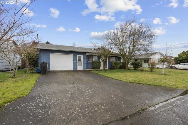 ranch-style house with a garage, driveway, and a front yard