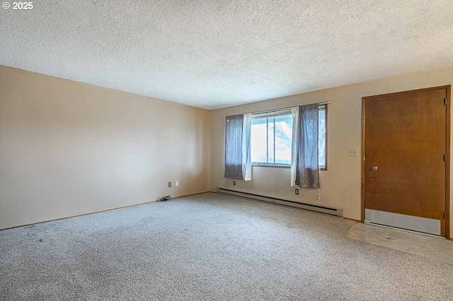 unfurnished room featuring a baseboard radiator and a textured ceiling