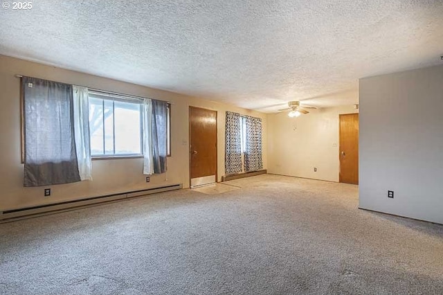 carpeted empty room with a textured ceiling, a ceiling fan, and a baseboard radiator