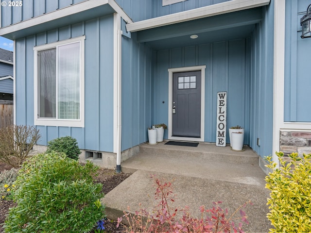 doorway to property featuring board and batten siding