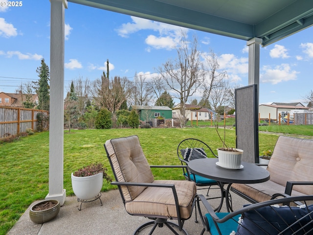 view of patio featuring fence