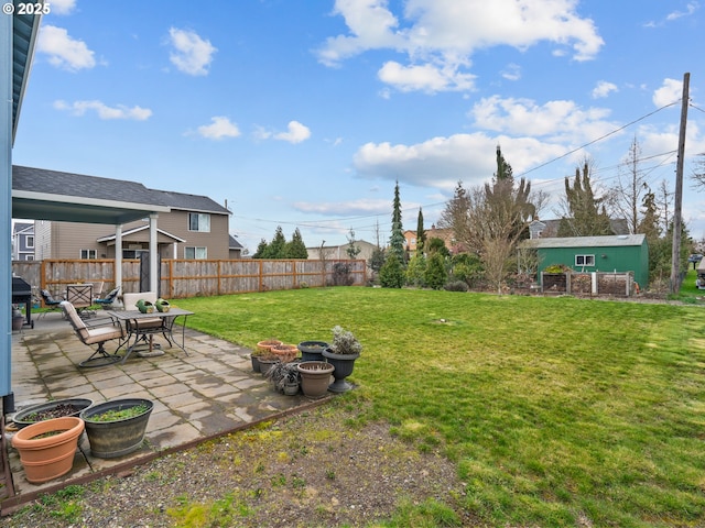 view of yard featuring a patio area and fence